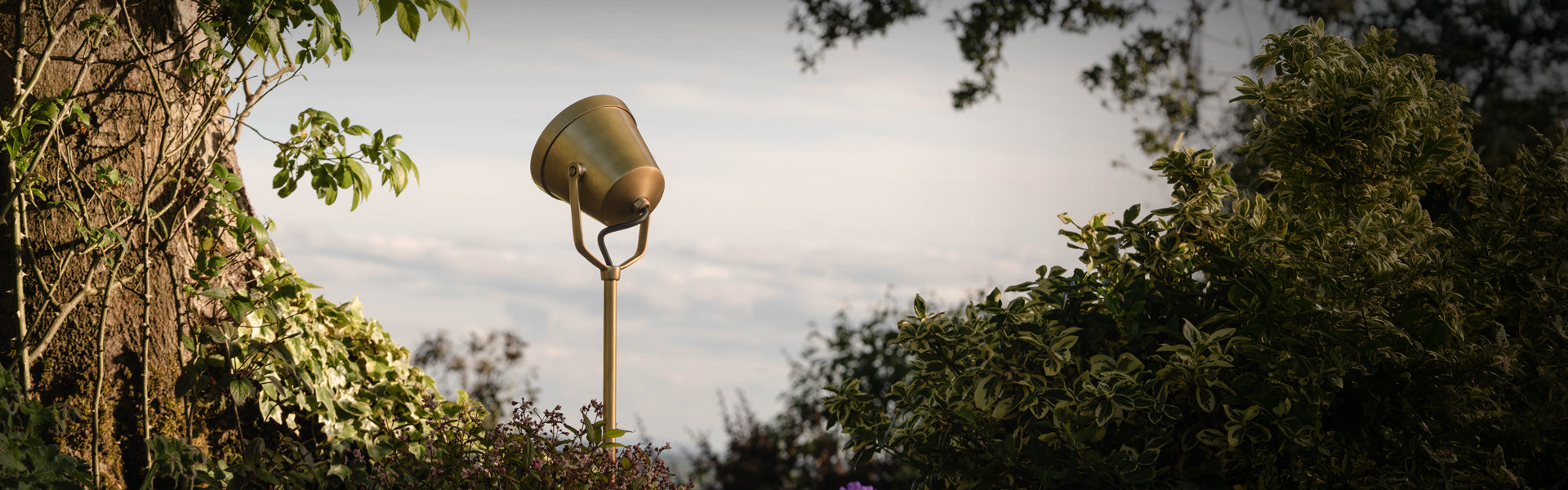 Antique brass wall light with fluted glass by Corston