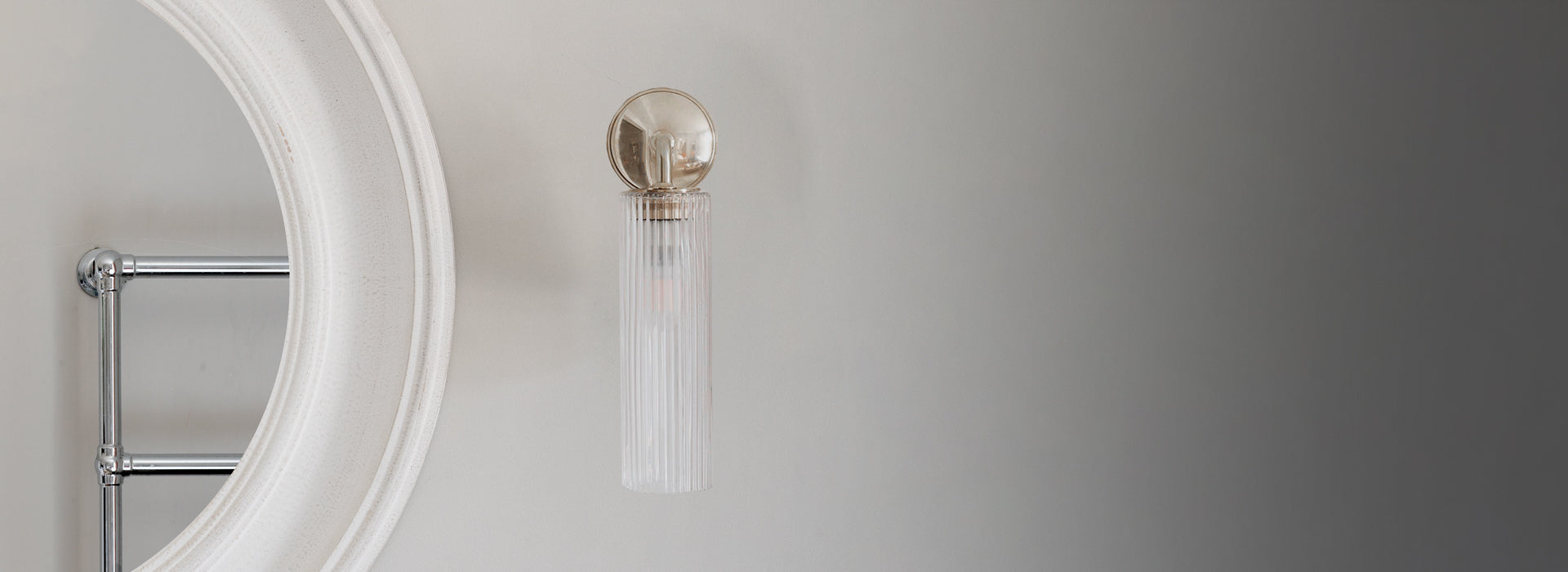 Bronze Wall light with fluted glass on white wall