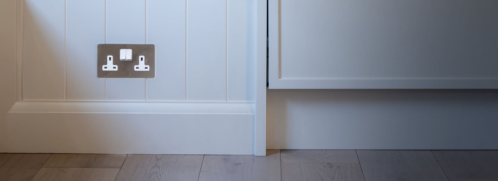 2 toggle switch in polished nickel on white wall