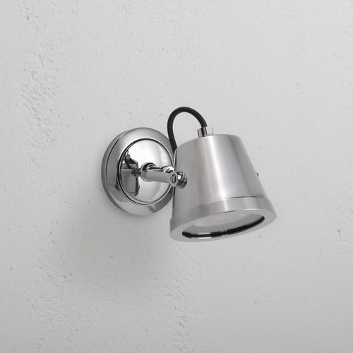 Cambridge Wall Floodlight – Polished Nickel: outdoor floodlight with conical shade, mounted on white wall.