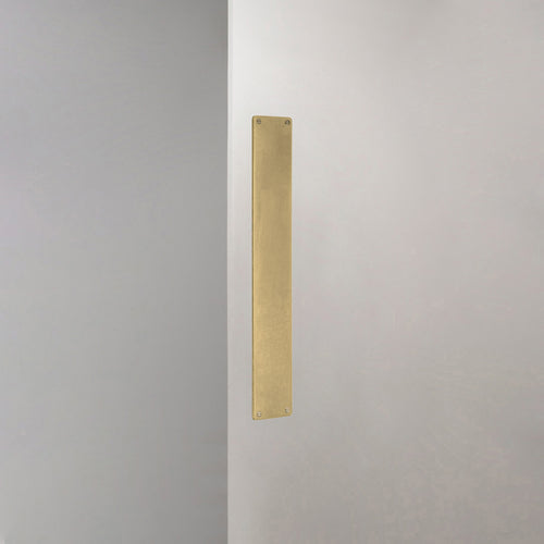 Corston Push Plate In Antique Brass On White Background