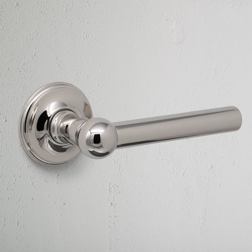 Polished Nickel Harper Fixed Door Handle On White Background